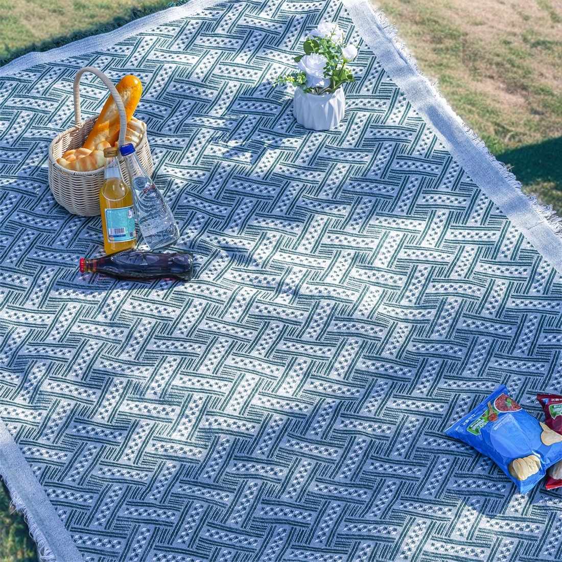 Family enjoying picnic on moistureproof tablecloth