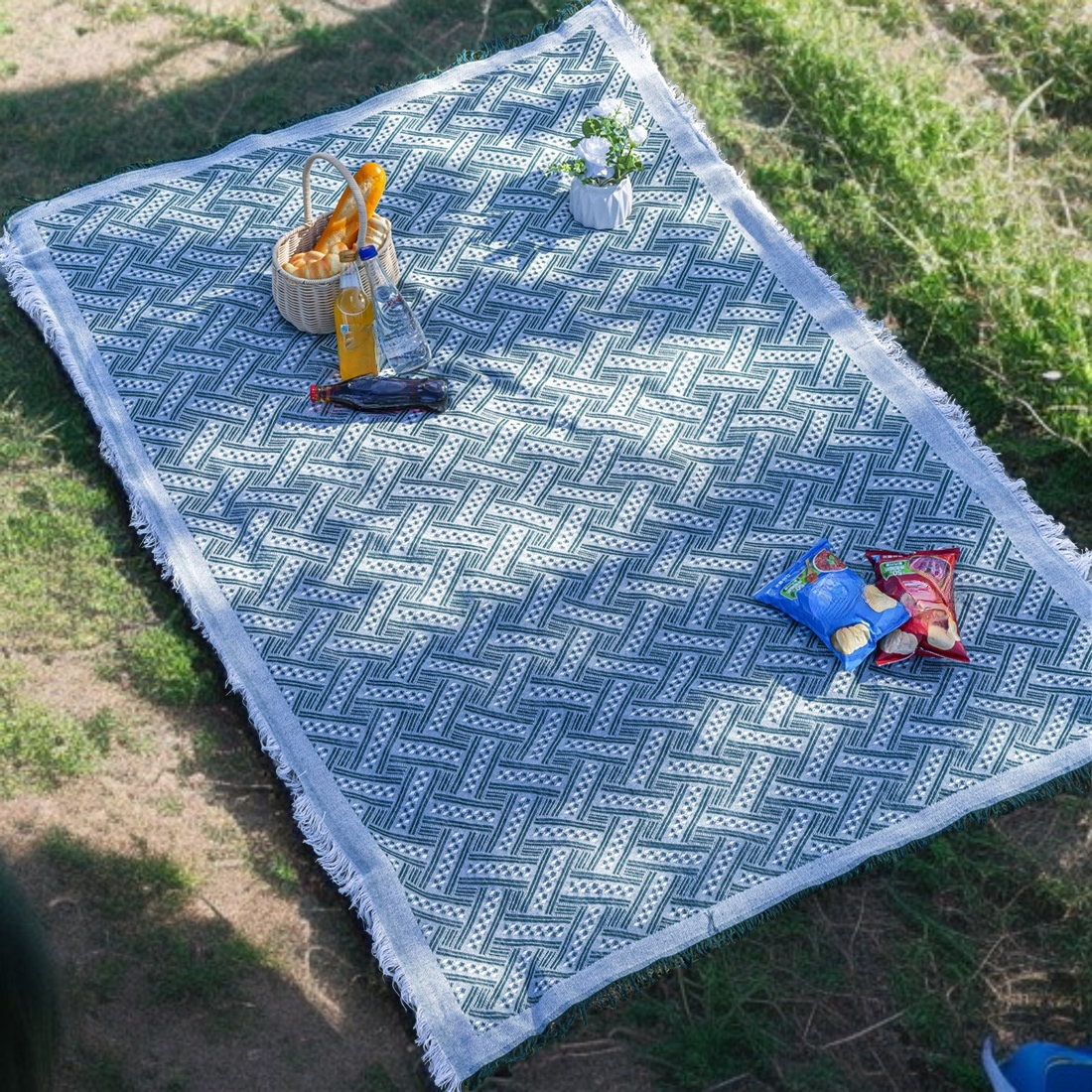Versatile picnic blanket spread on grass